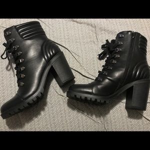 Slightly worn Guess boots.